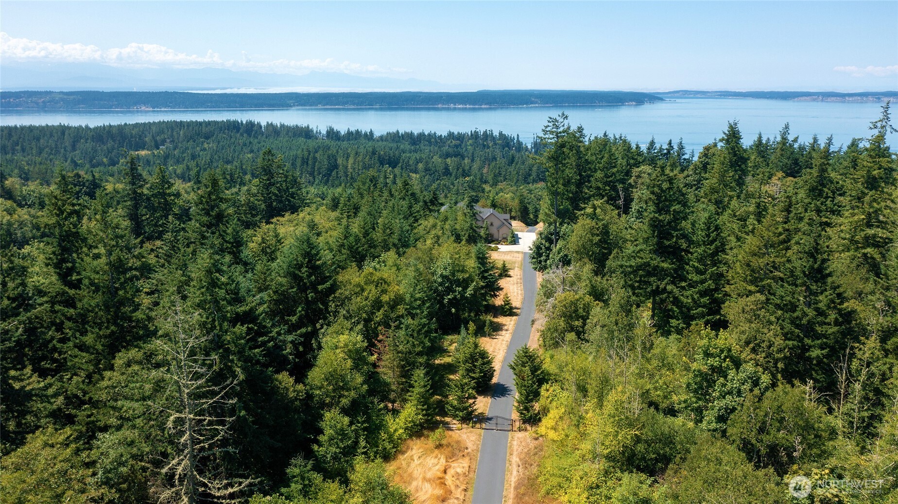 67 North Gilbertson Road Camano Island, WA 98282 - Photo 39 of 40 an aerial view of a houses with a yard and lake view