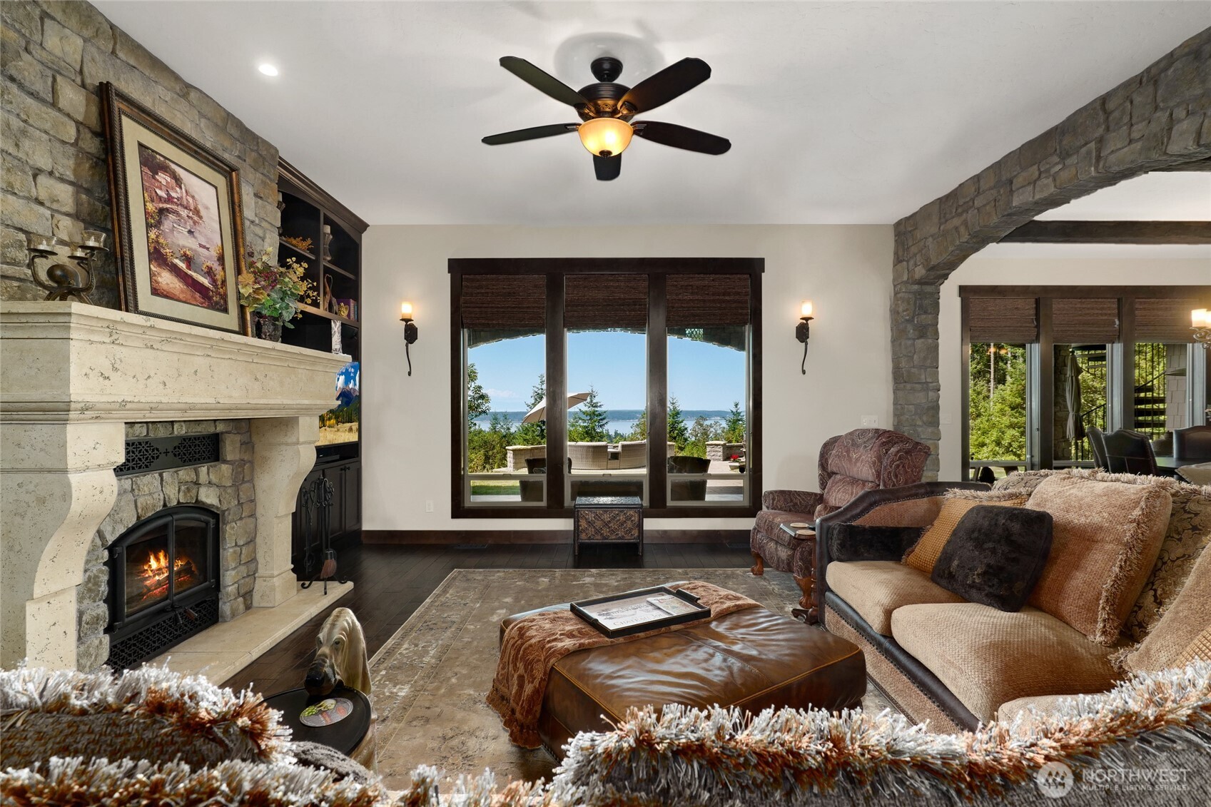 67 North Gilbertson Road Camano Island, WA 98282 - Photo 9 of 40 a living room with furniture fireplace and a large window