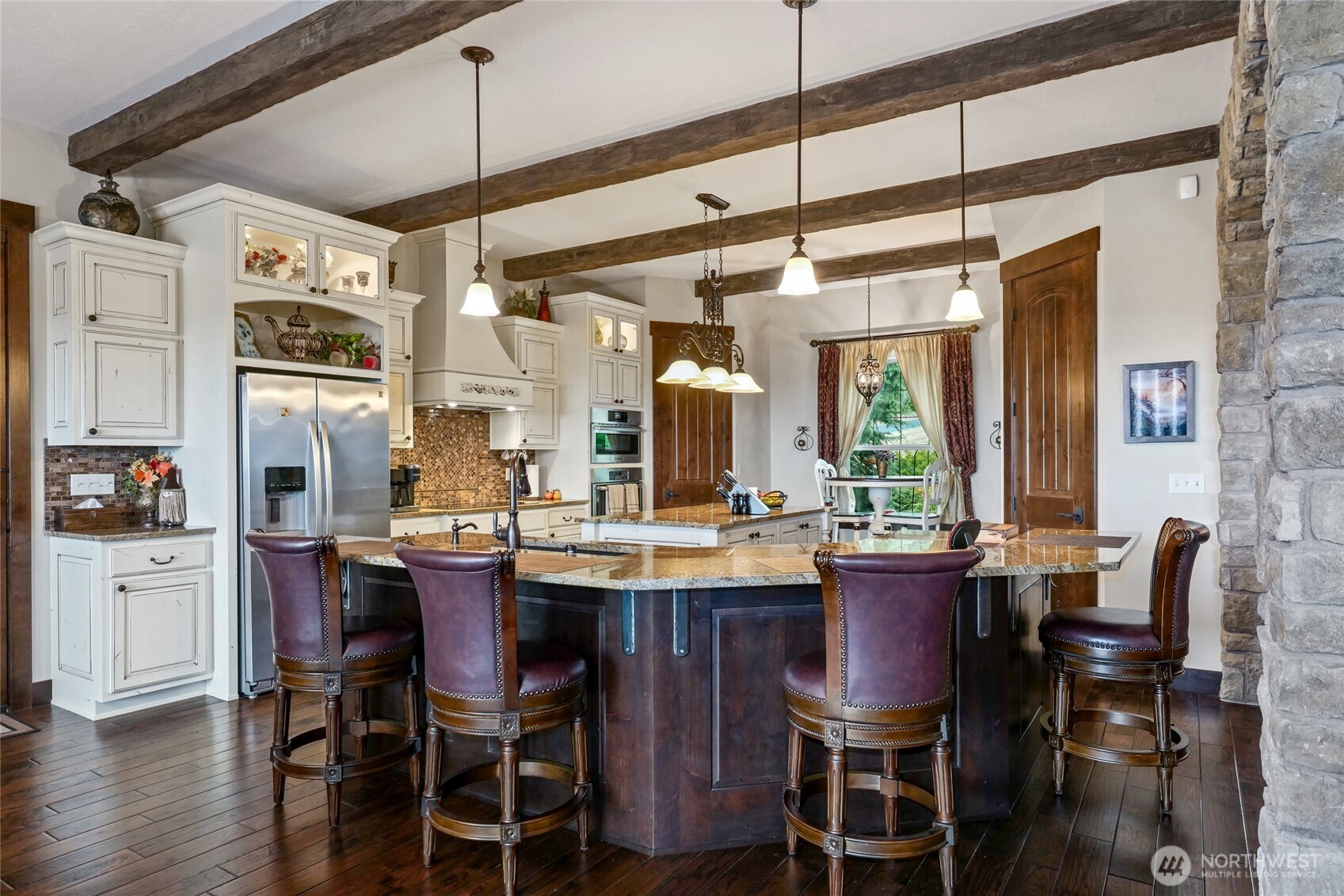 67 North Gilbertson Road Camano Island, WA 98282 - Photo 10 of 40 a dining table with chairs and wooden floor