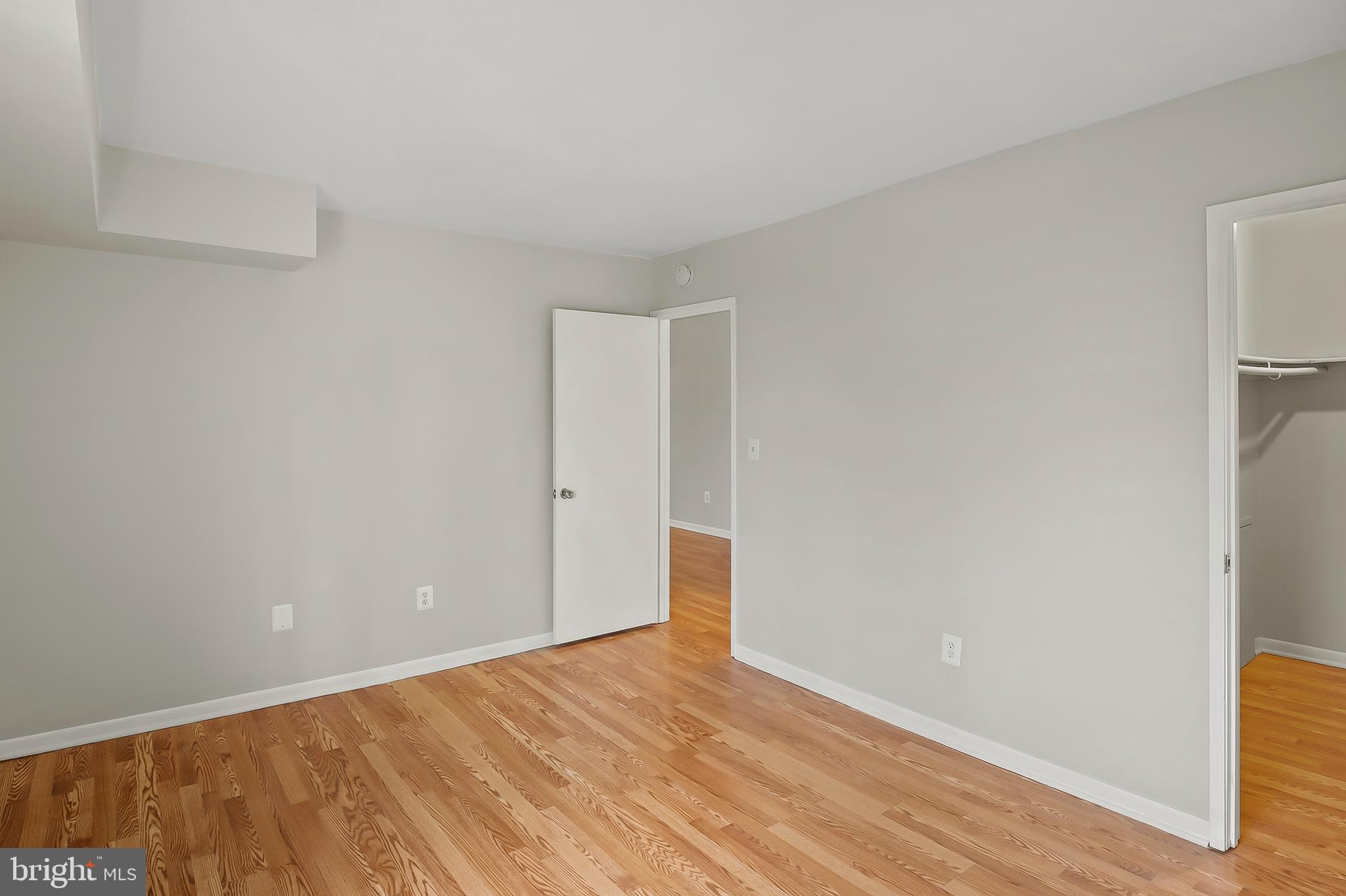 5870 Thunder Hill Road, Unit C2 Columbia, MD 21045 - Photo 13 of 23 a view of an empty room with wooden floor