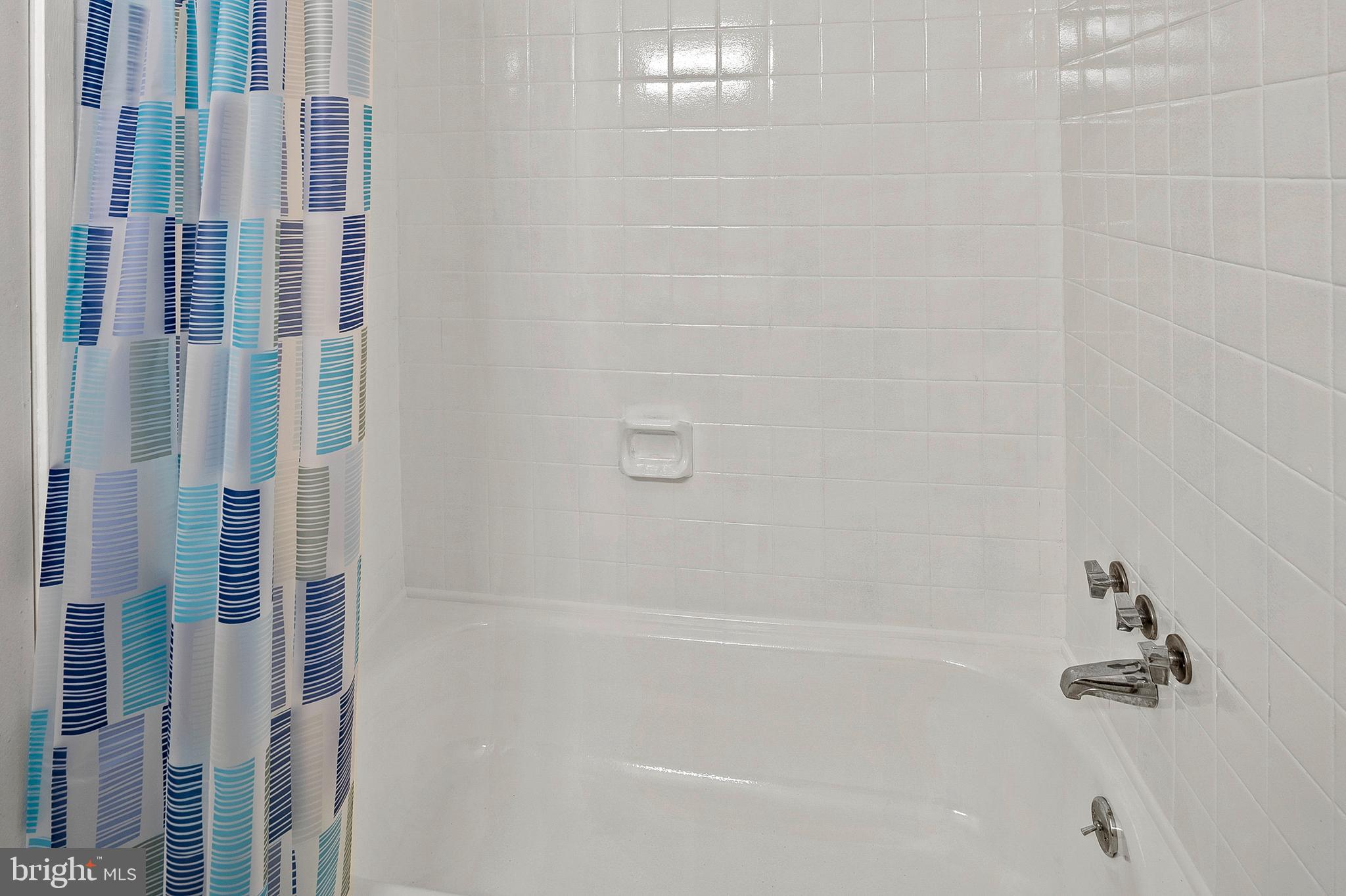 5870 Thunder Hill Road, Unit C2 Columbia, MD 21045 - Photo 17 of 23 a close up of a bathtub curtain