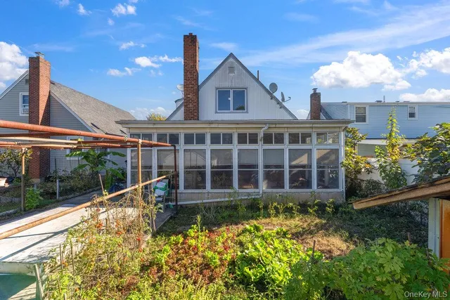 a view of a house with wooden fence