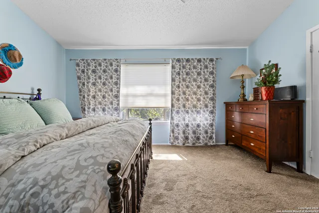 a bedroom with a bed and a table in it