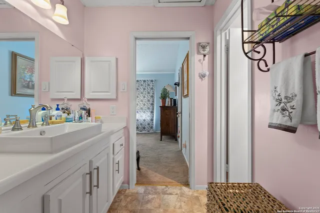 a bathroom with a glass shower door