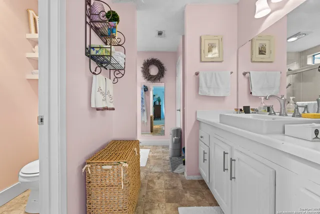 a bathroom with a sink and a toilet