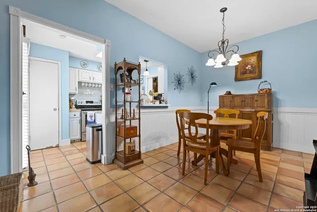 a kitchen with stainless steel appliances a sink stove and cabinets