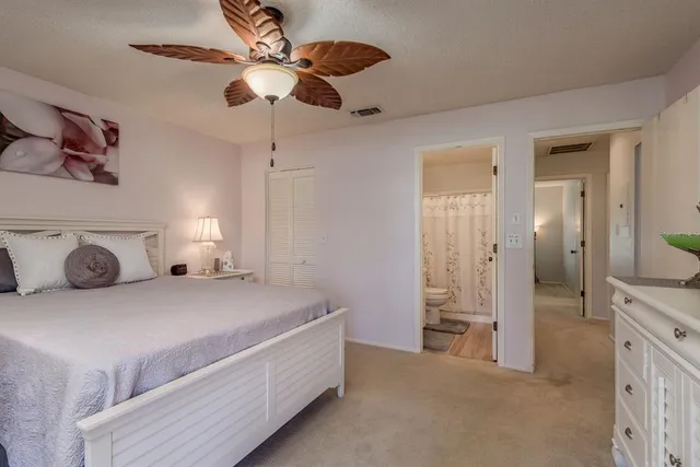 a living room with furniture and floor to ceiling windows