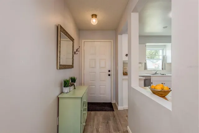 a living room with furniture a window and a chandelier