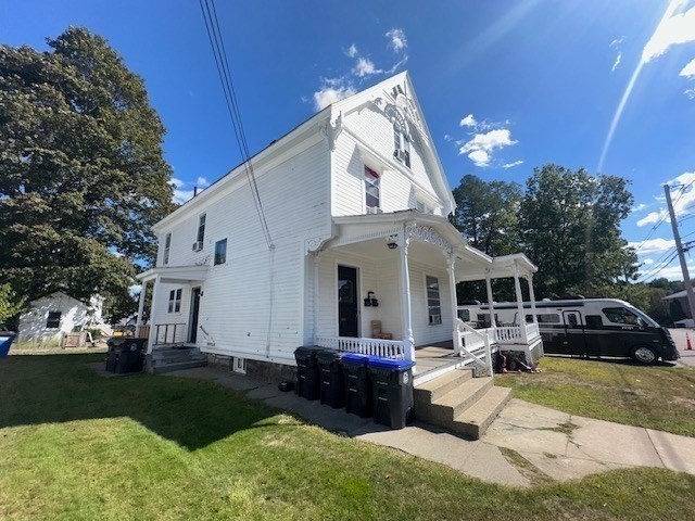 55 Cottage Street Hudson, MA 01749 - Photo 2 of 11 a view of a house with a big yard