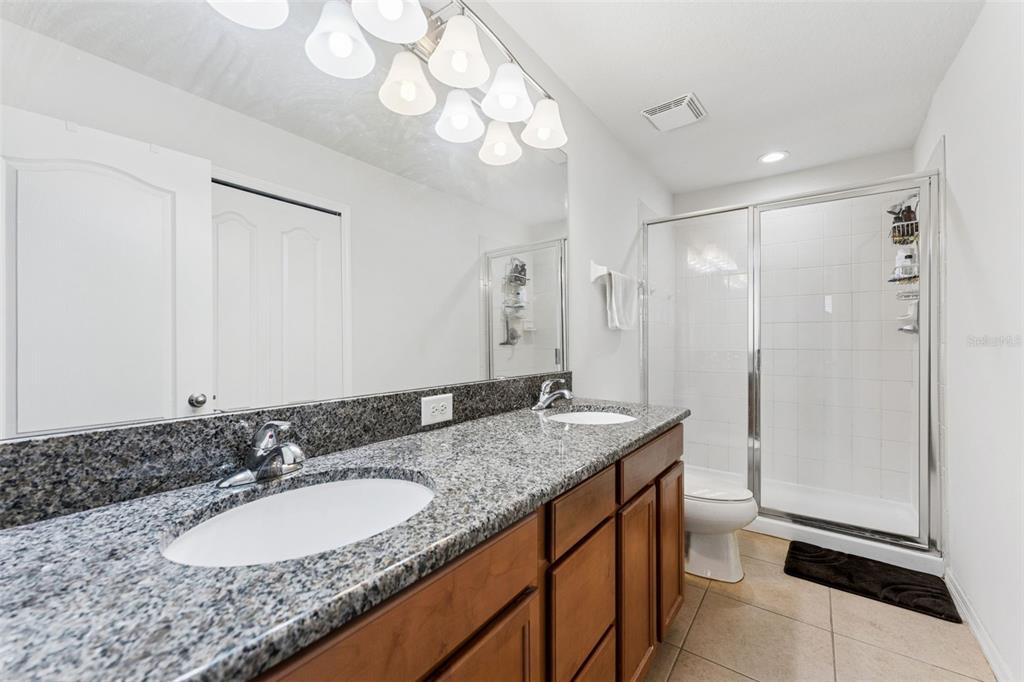 2129 Lennox Dale Lane Brandon, FL 33510 - Photo 20 of 38 a bathroom with a granite countertop sink and a mirror
