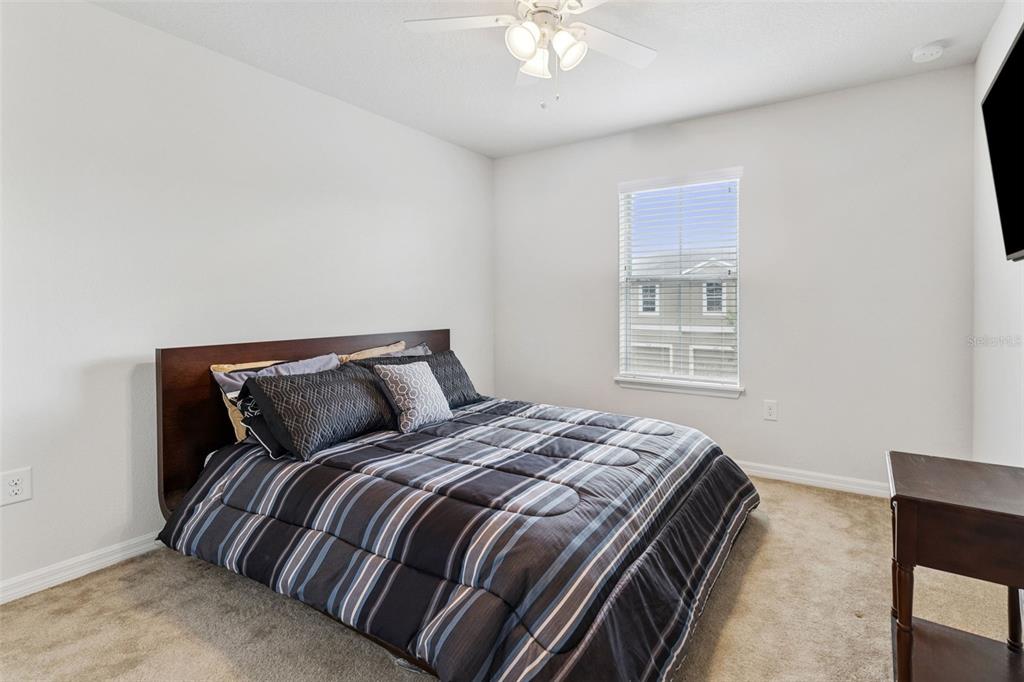 2129 Lennox Dale Lane Brandon, FL 33510 - Photo 21 of 38 a bedroom with a bed and wooden floor