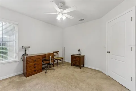 a view of a livingroom with a ceiling fan