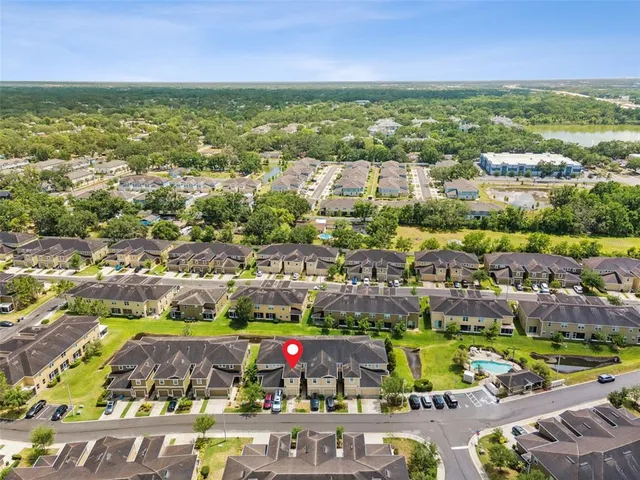 an aerial view of a house with a yard