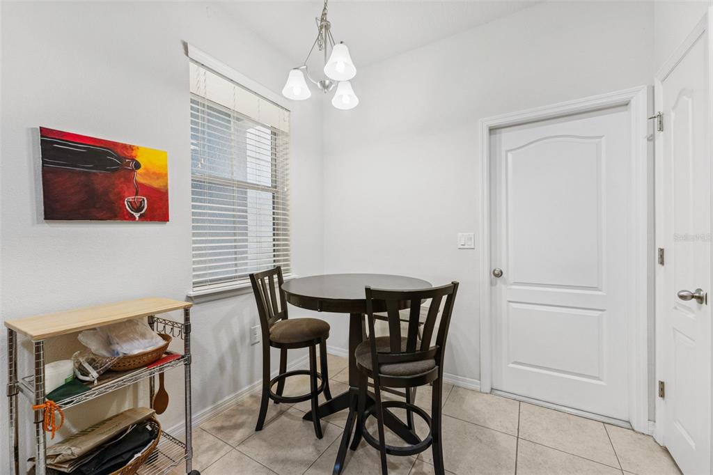 2129 Lennox Dale Lane Brandon, FL 33510 - Photo 9 of 38 a view of a dining room with furniture and chandelier