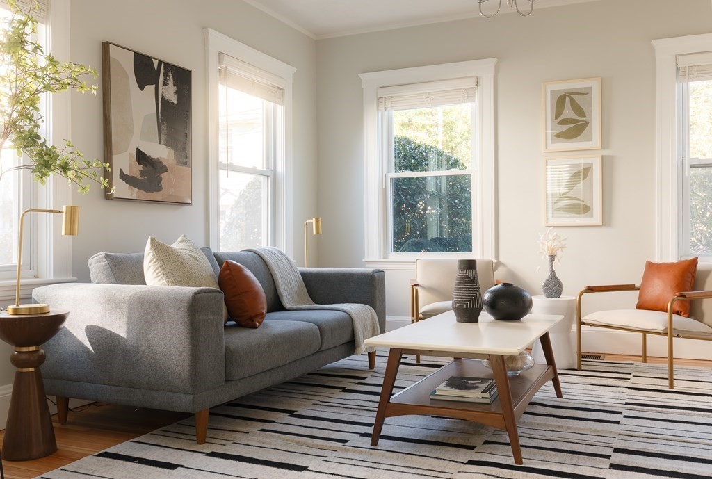 19 Riverside Street Needham, MA 02494 - Photo 3 of 18 a living room with furniture a table and a large window