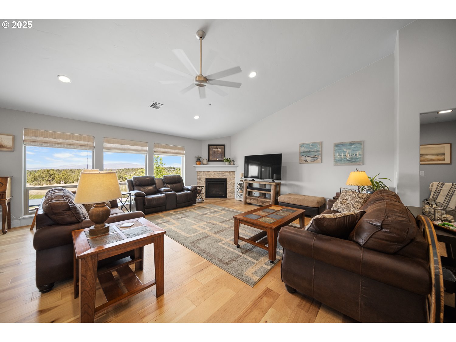 4416 Southeast Laredo Road Prineville, OR 97754 - Photo 11 of 36 a living room with furniture a flat screen tv and a window