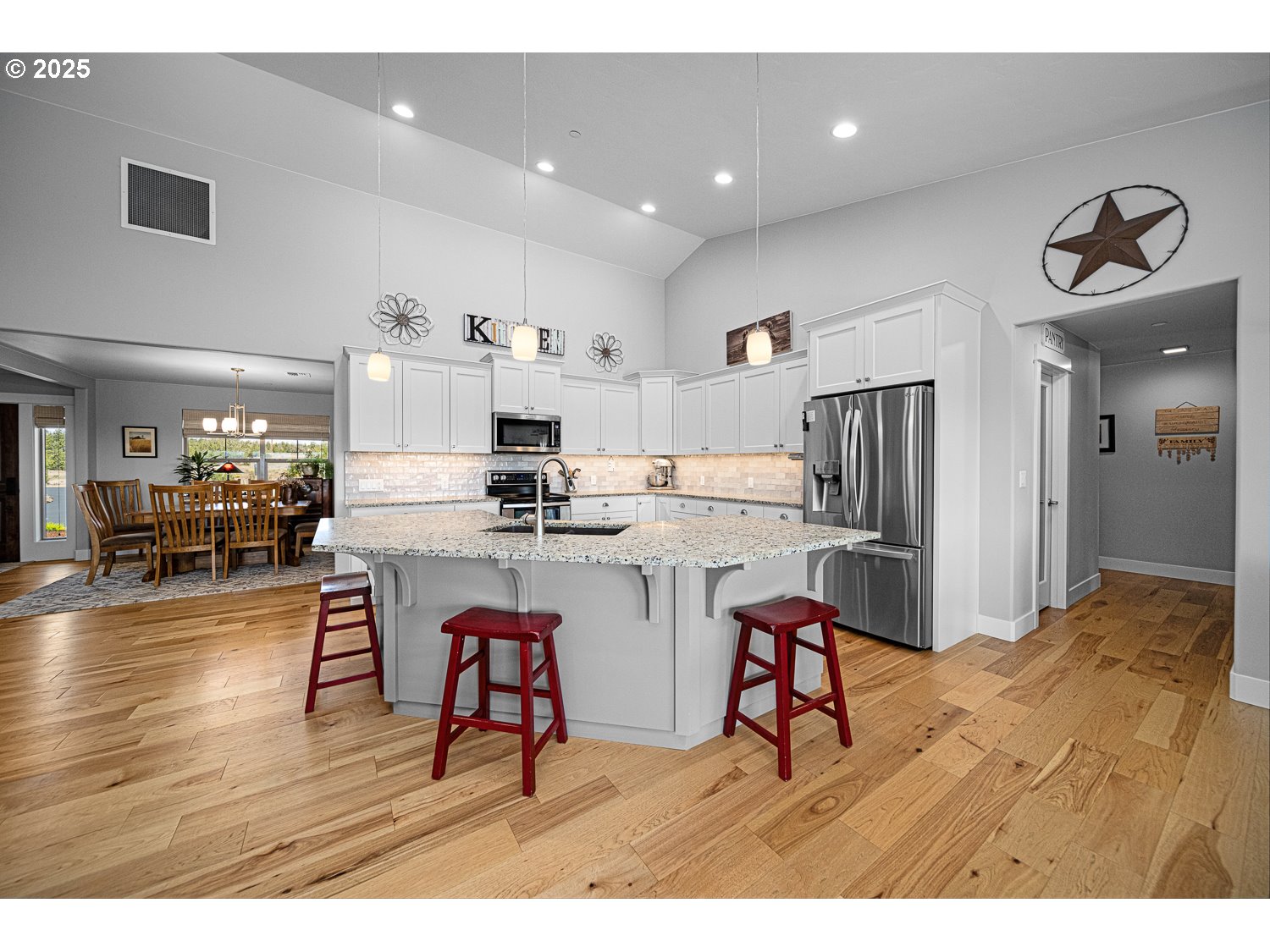 4416 Southeast Laredo Road Prineville, OR 97754 - Photo 16 of 36 a living room with stainless steel appliances kitchen island granite countertop furniture and a view of kitchen