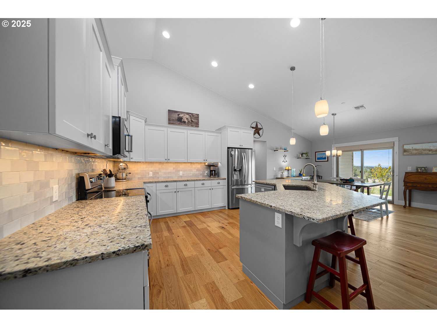 4416 Southeast Laredo Road Prineville, OR 97754 - Photo 18 of 36 a kitchen with a sink a counter top space and stainless steel appliances