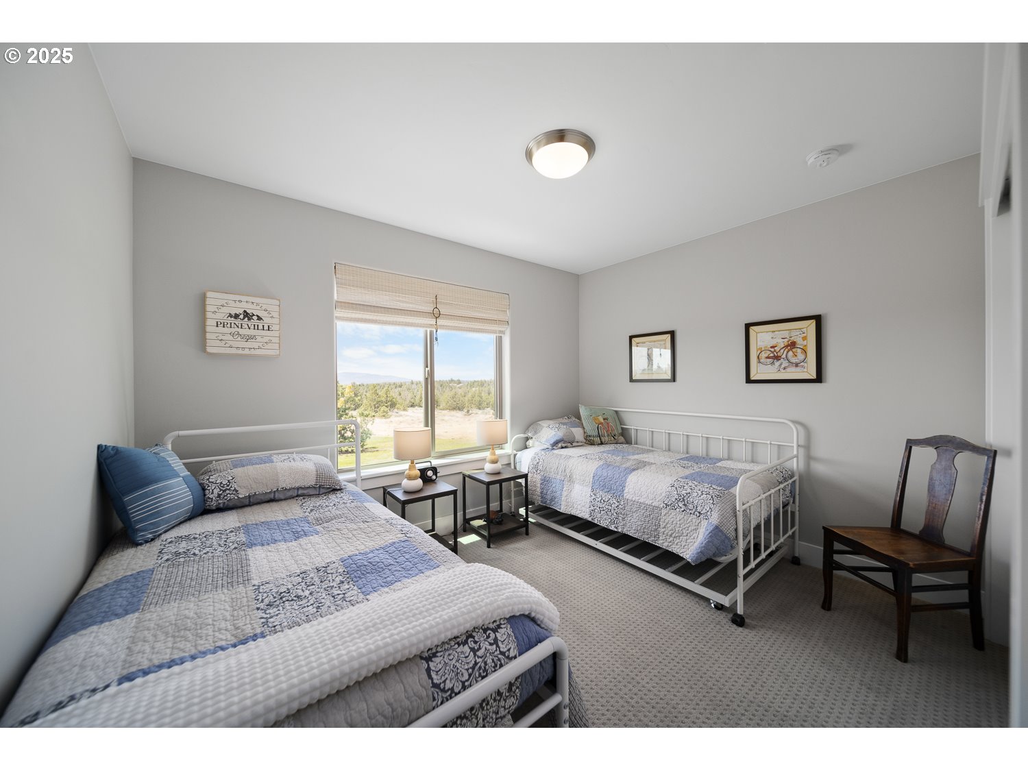 4416 Southeast Laredo Road Prineville, OR 97754 - Photo 30 of 36 a bedroom with two beds and a couch