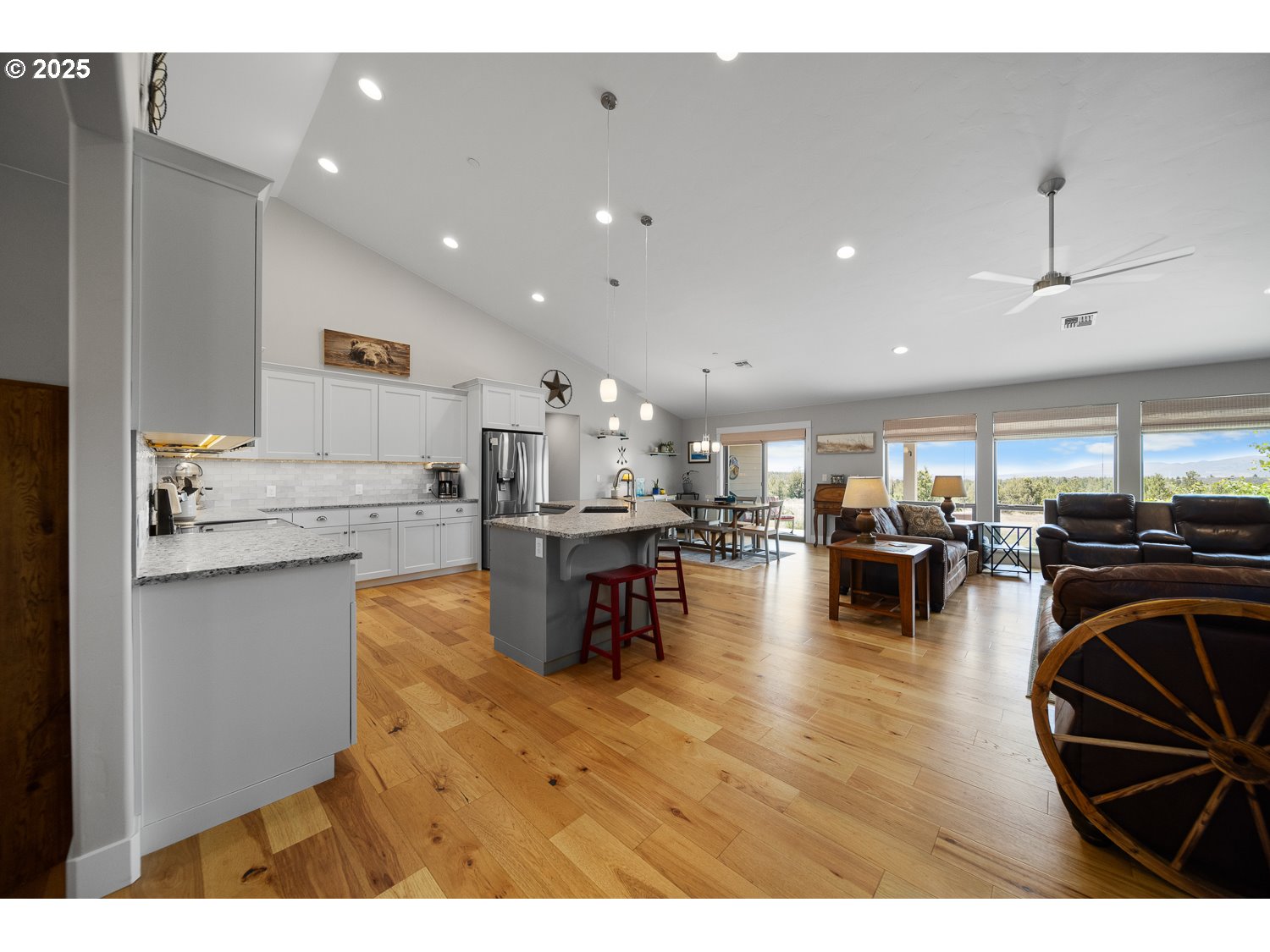4416 Southeast Laredo Road Prineville, OR 97754 - Photo 9 of 36 a living room with stainless steel appliances furniture a rug and a kitchen view