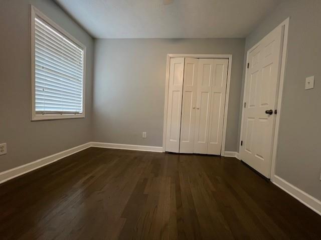 6935 Fielder Road Rex, GA 30273 - Photo 15 of 22 a view of an empty room with wooden floor and a window