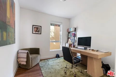 a workspace with furniture and window