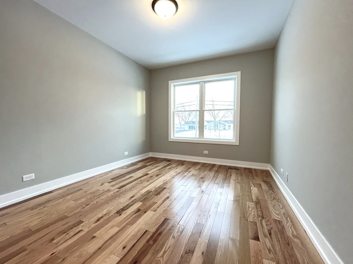 970 Partridge Circle Marengo, IL 60152 - Photo 11 of 17 an empty room with wooden floor and windows