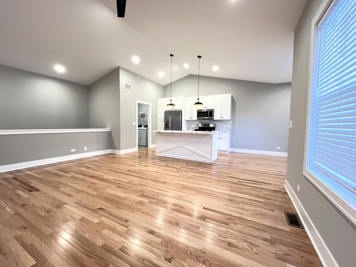 970 Partridge Circle Marengo, IL 60152 - Photo 2 of 17 a view of a kitchen with kitchen island stainless steel appliances wooden floor and living room view