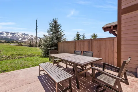 a view of a backyard with sitting area