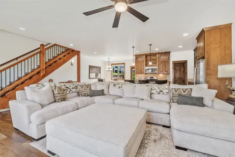 a living room with furniture or kitchen view and a chandelier