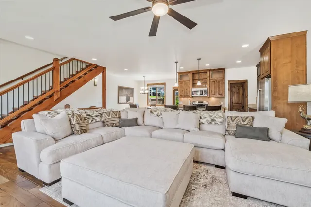 a living room with furniture or kitchen view and a chandelier