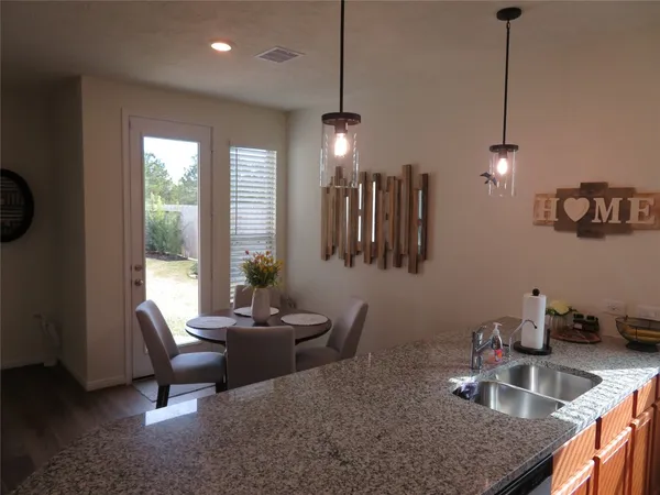 a kitchen with a sink a counter space and a window