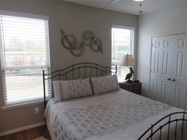 a bedroom with a bed and window