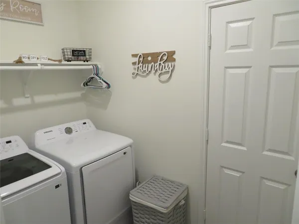 a utility room with dryer and washer