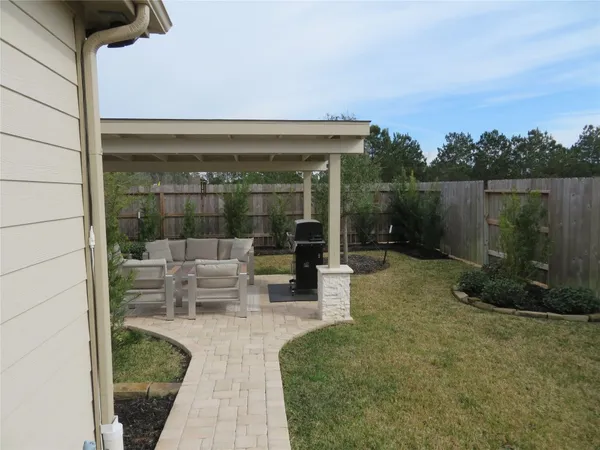a view of a swimming pool and lounge chair