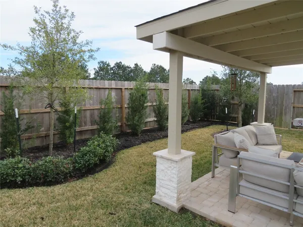 a view of a couches in patio of a house