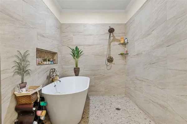 a bathroom with a bathtub and sink