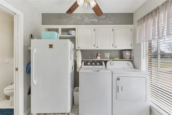 a utility room with dryer and washer