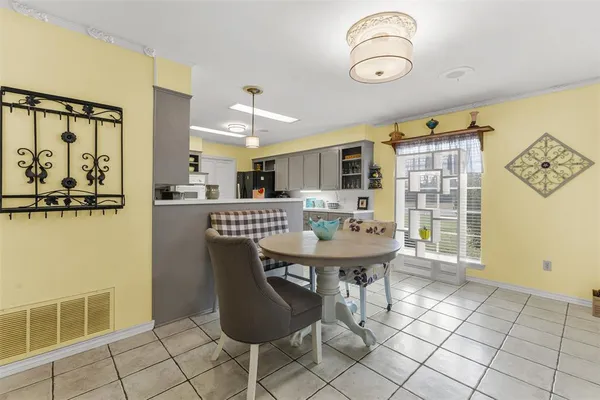 a view of a kitchen with furniture and window
