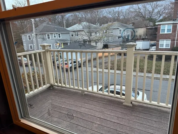 a view of a balcony with a potted plant