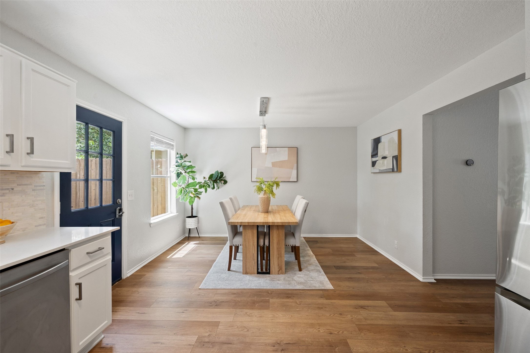 4529 Best Way Austin, TX 78725 - Photo 4 of 34 Dedicated dining area with large windows overlooking the private backyard