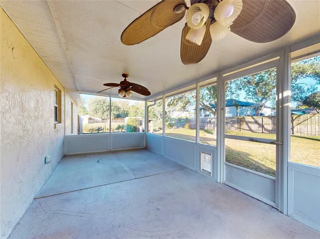 a front view of a house with a yard table and chairs