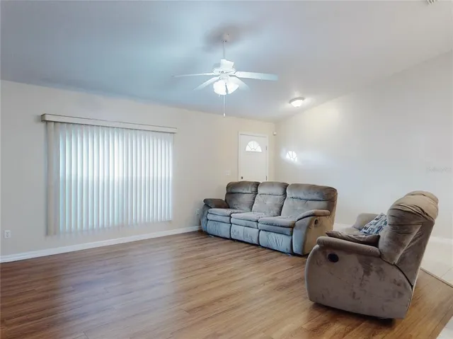 a kitchen with stainless steel appliances a stove microwave and sink