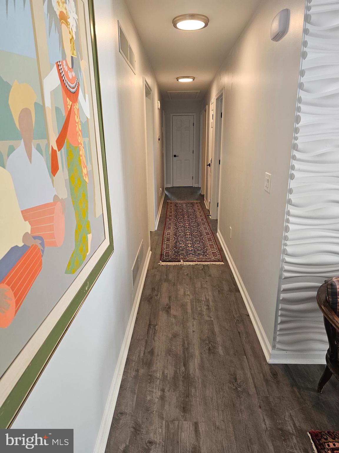 22 Arnell Road Rehoboth Beach, DE 19971 - Photo 10 of 22 a view of a hallway with wooden floor and staircase
