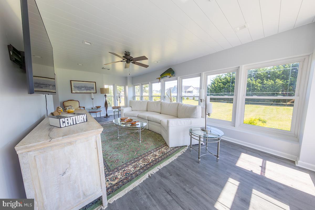 22 Arnell Road Rehoboth Beach, DE 19971 - Photo 15 of 22 a living room with furniture and a large window