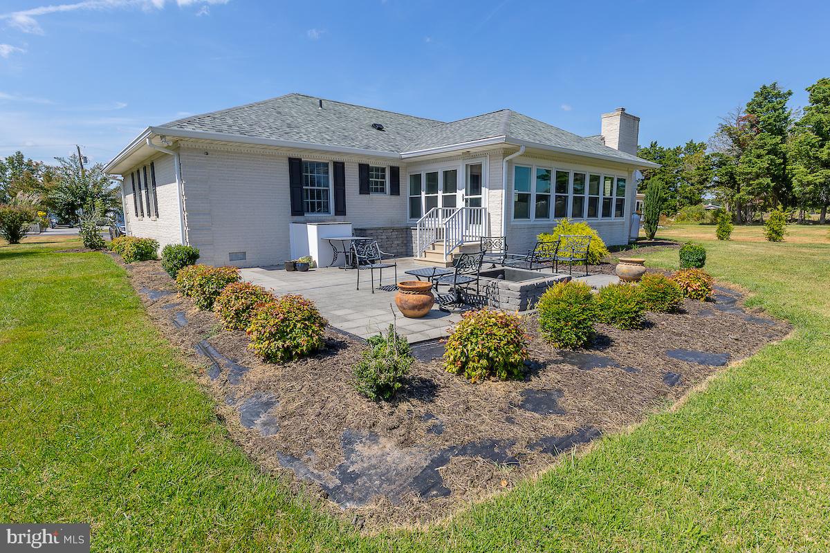 22 Arnell Road Rehoboth Beach, DE 19971 - Photo 5 of 22 a front view of a house with yard and green space