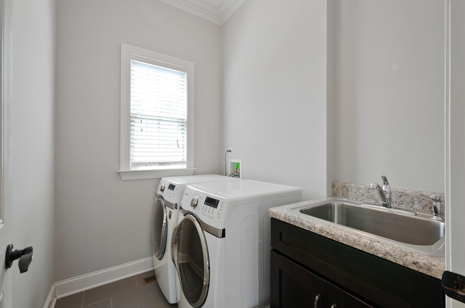 460 Truman Road West Franklin, TN 37064 - Photo 20 of 24 laundry Room with natural light and sink cabinet.