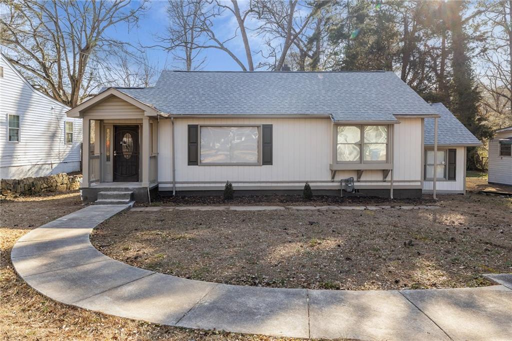 2060 Baker Road Northwest Atlanta, GA 30318 - Photo 1 of 24 a view of a house with a dry trees