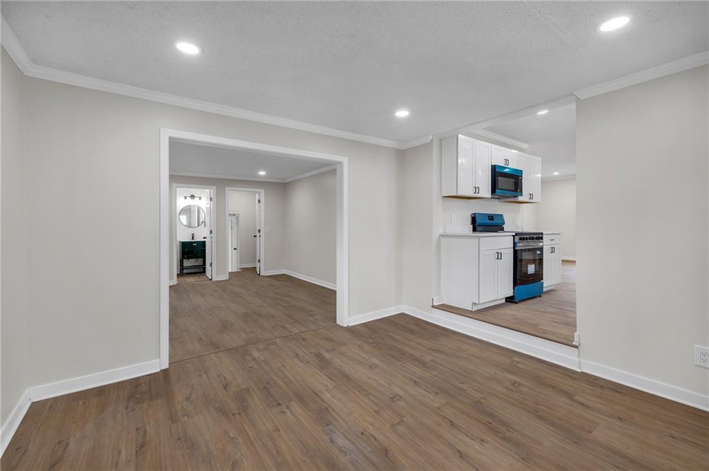 2060 Baker Road Northwest Atlanta, GA 30318 - Photo 16 of 24 a view of a kitchen with a sink and a refrigerator