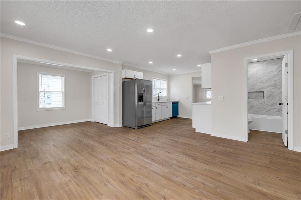 2060 Baker Road Northwest Atlanta, GA 30318 - Photo 6 of 24 a view of empty room with wooden floor